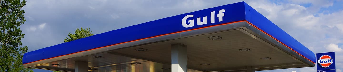 The blue canopy of a Gulf station